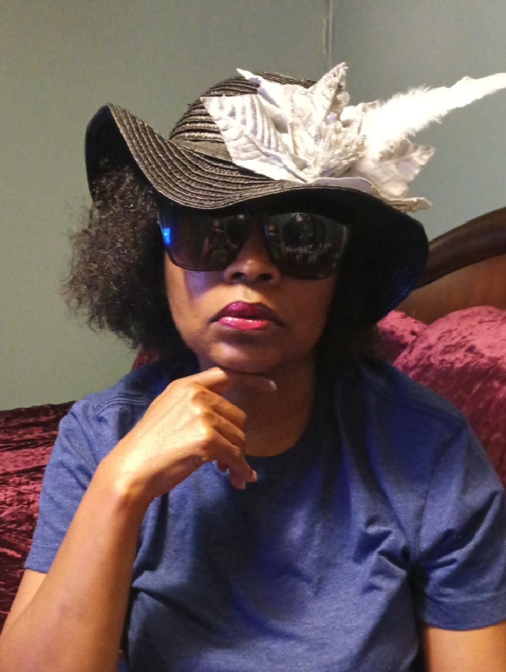 Black Straw Wide-Brim Hat with White Feather Accent